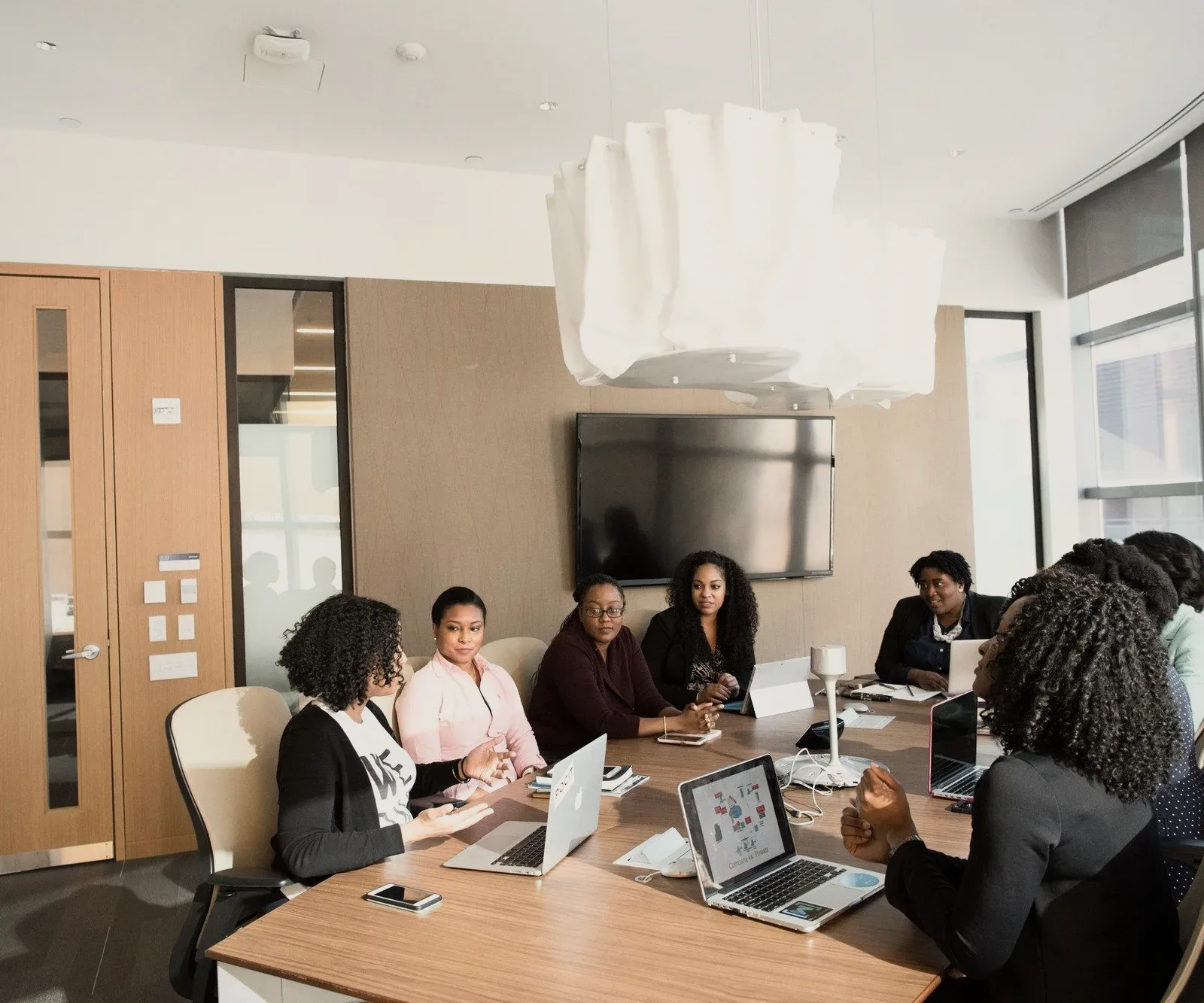 A team meeting in a bright boardroom.