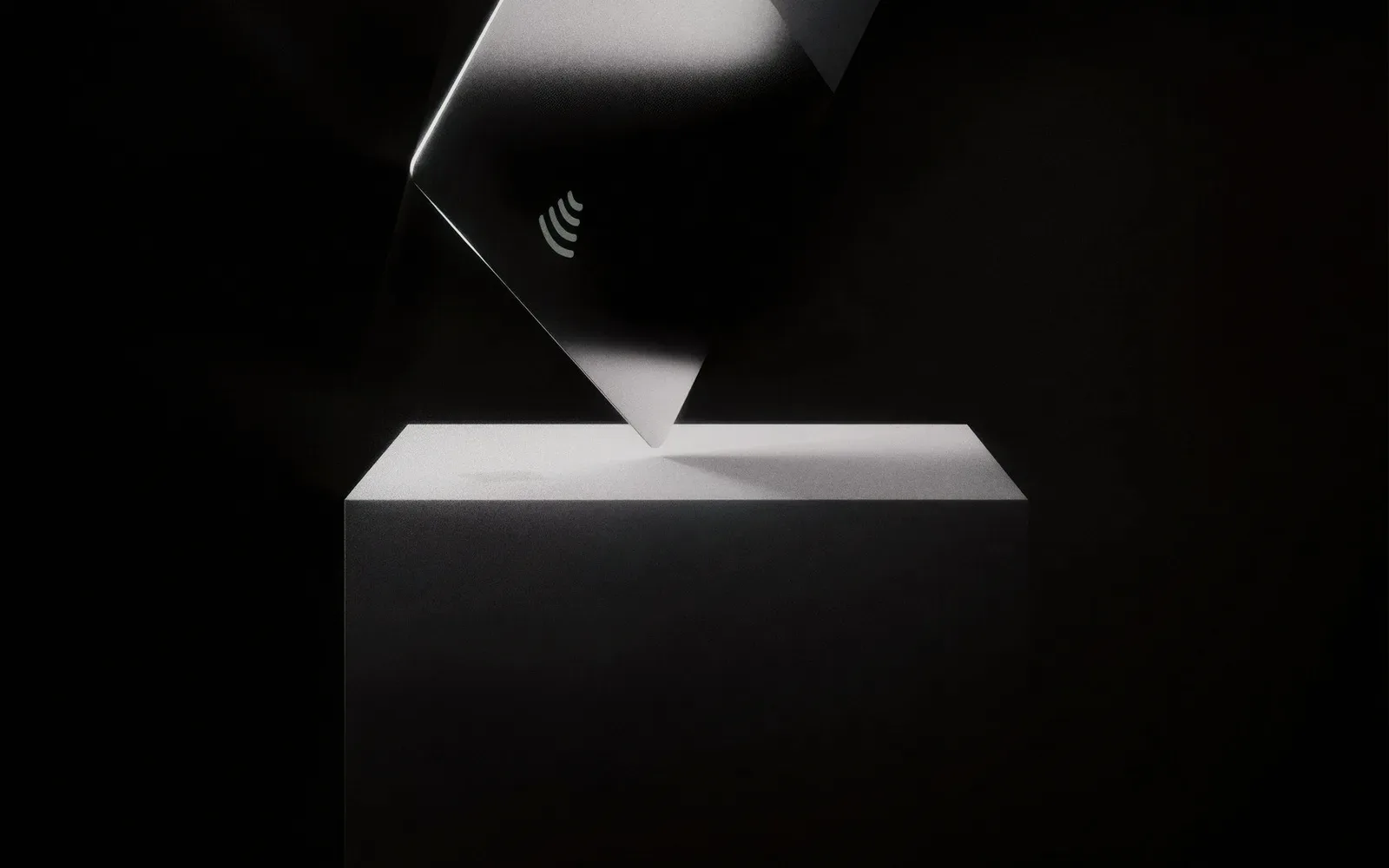 A dark card on a black surface.