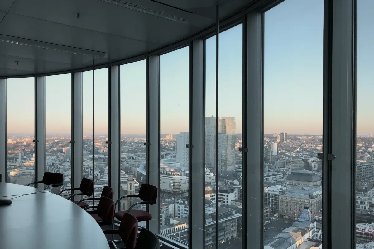 Chairs at a window over the city.