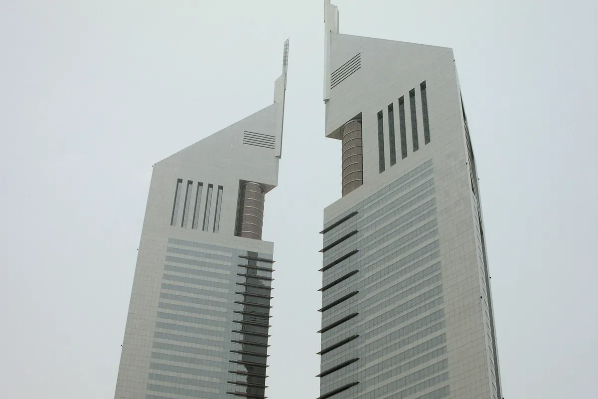 A concrete building under a white sky.