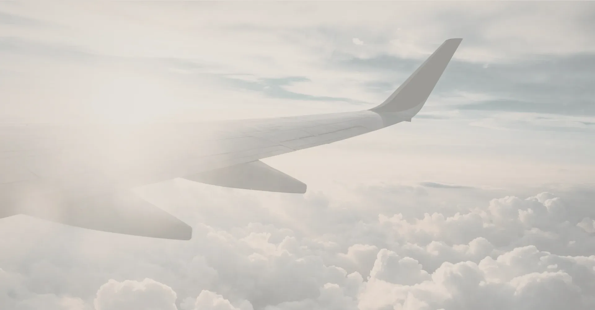 A wing over the clouds.