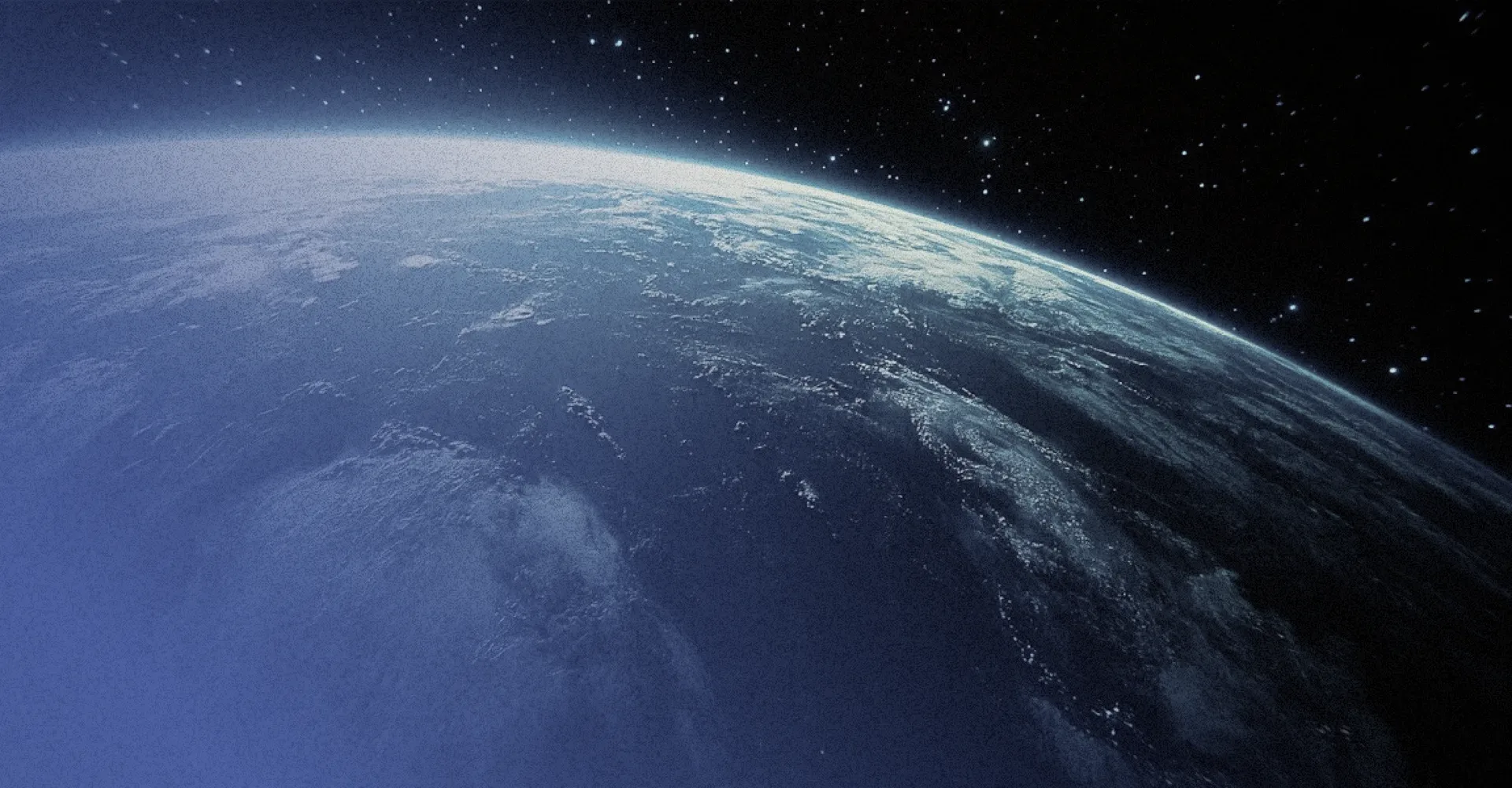 The earth from orbit, the sea in blue.