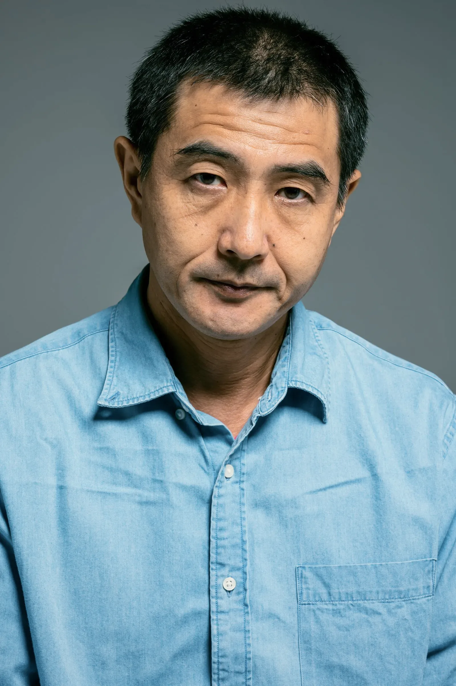 A stock portrait of a teacher against a plain background. Not a teacher at this school.