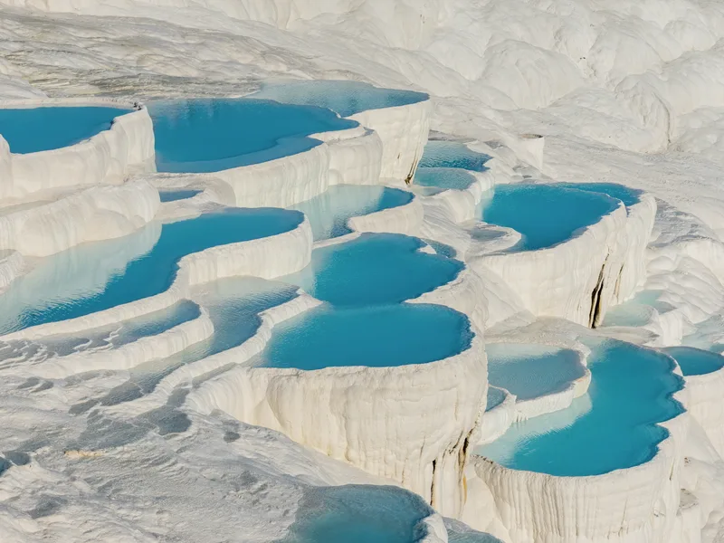 White terraces filled with blue water at Pamukkale.
