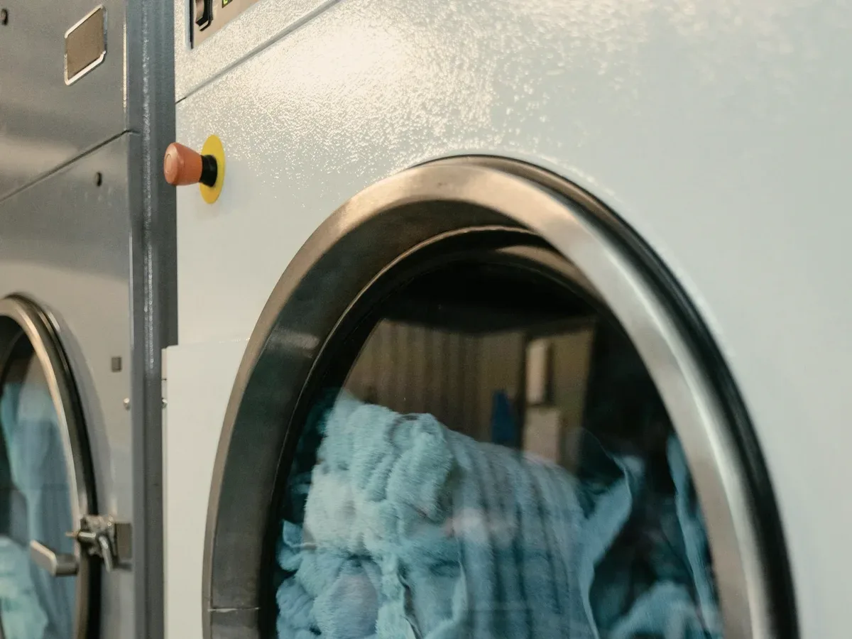 Blue towels in a dryer drum.