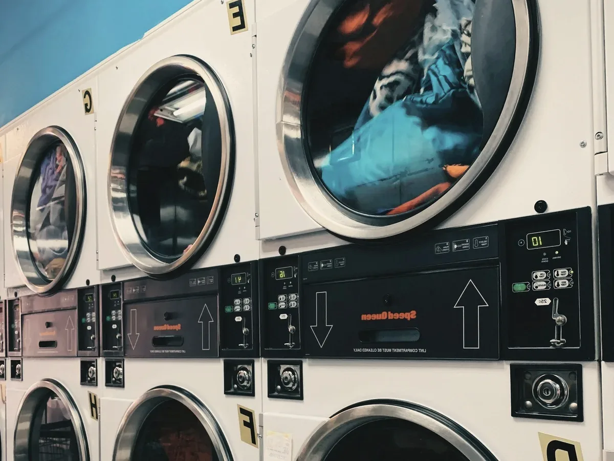 Washing machines in a laundrette.