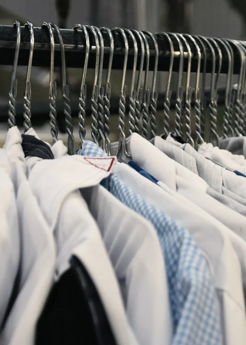 White shirts on wire hangers.