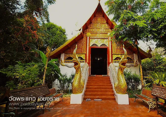 A Lanna temple hall with a red roof and naga stairs.